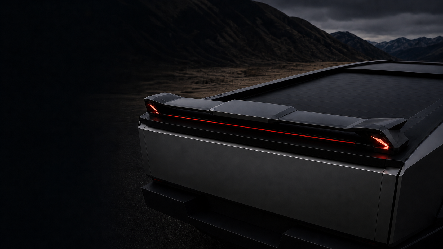 RailWing installed across the rear of a dark metallic truck in a mountain setting